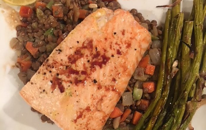 ​Braised Lentils topped with Baked Salmon and a side of Roasted Asparagus