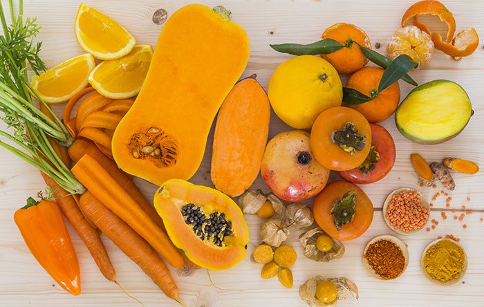 Assorted orange fruits and vegetables