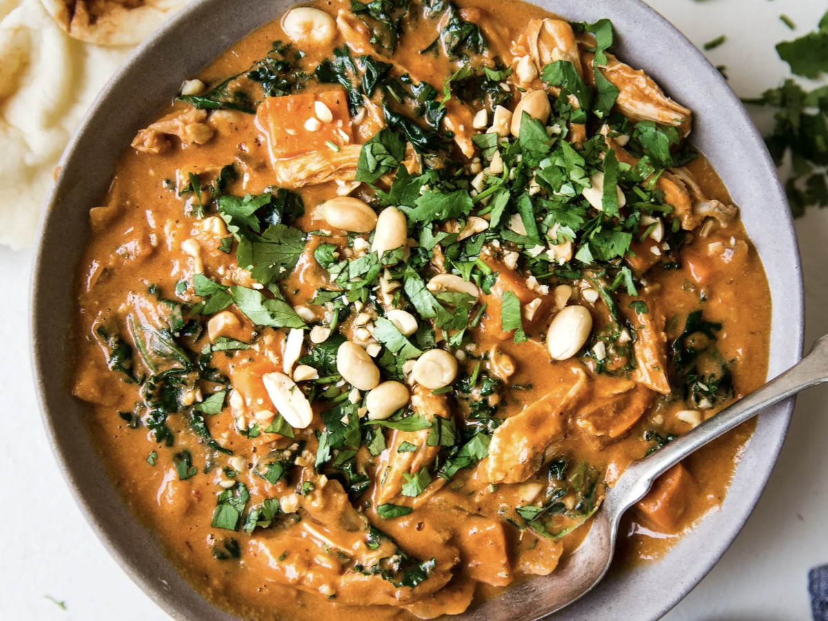 african inspired peanut soup with lots of toppings