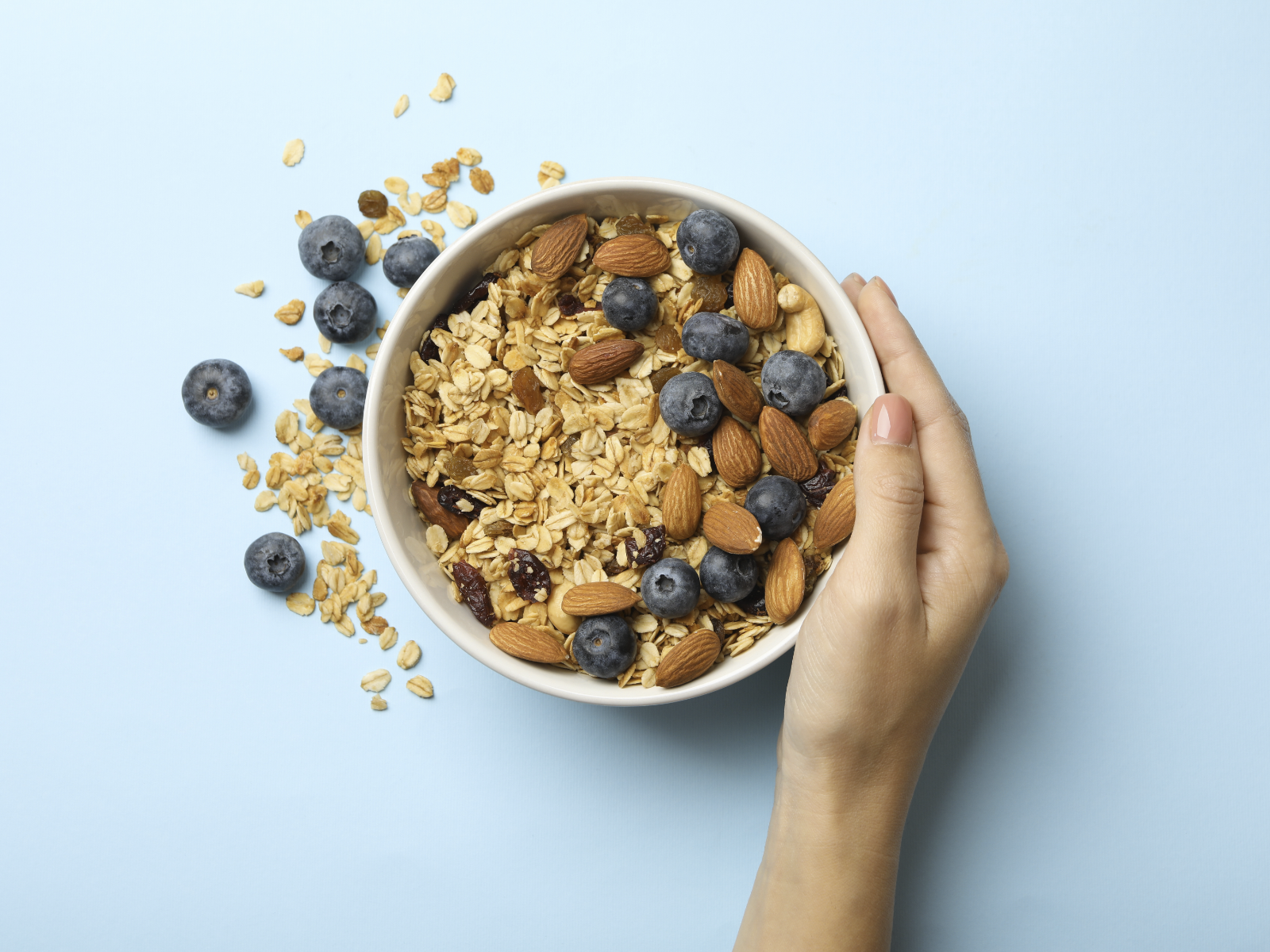 bowl with oats and almonds and blueberries and cashews