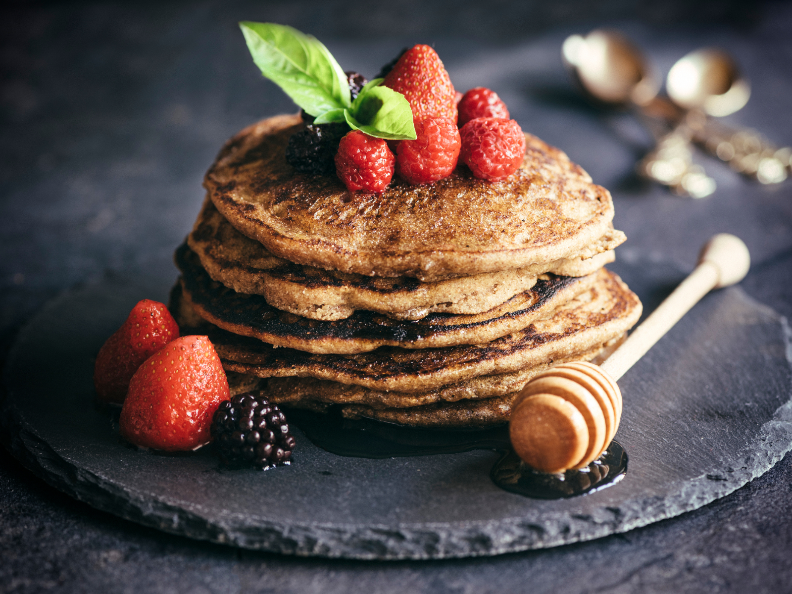 buckwheat pancakes on a plate with fruit