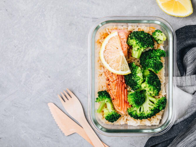 salmon meal prep container with quinoa and broccoli