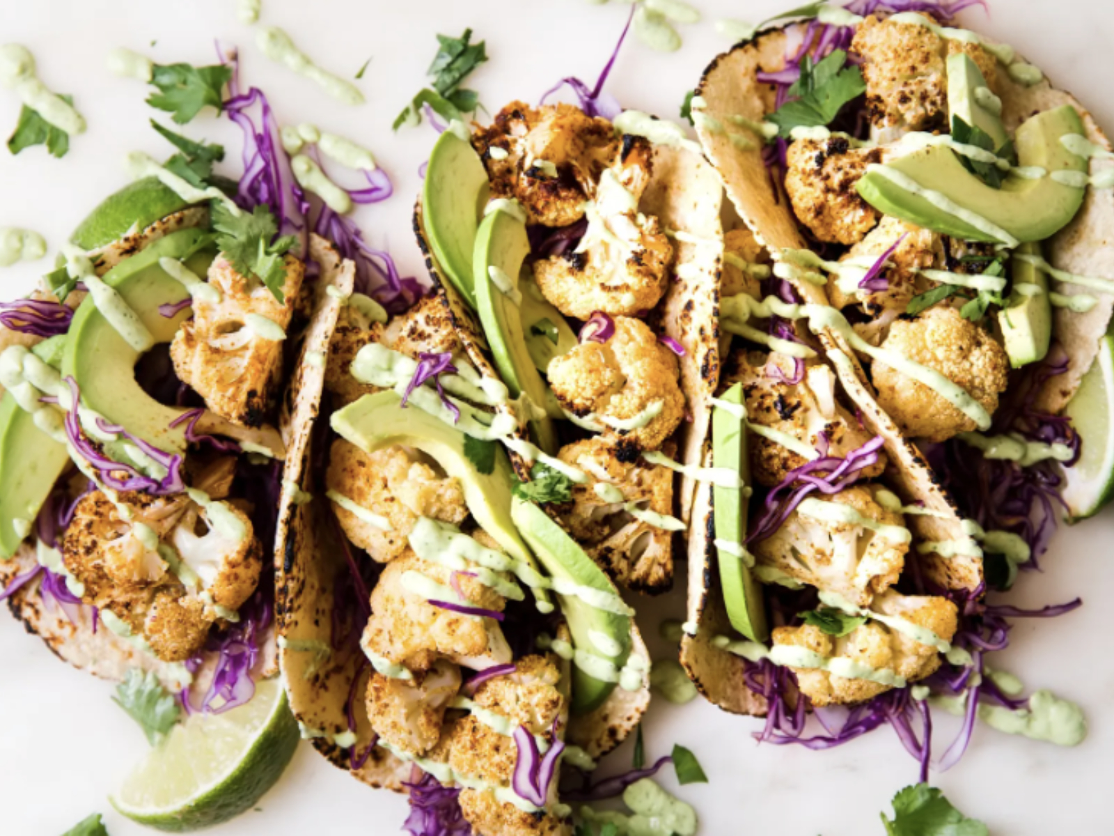 roasted cauliflower tacos with avocado and sauce