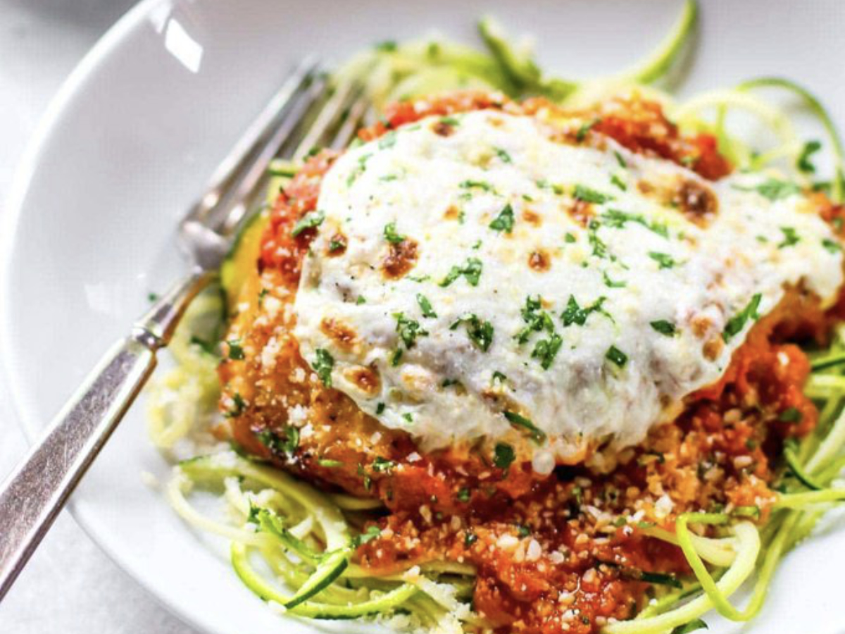 chicken parmesan with zoodles on a plate