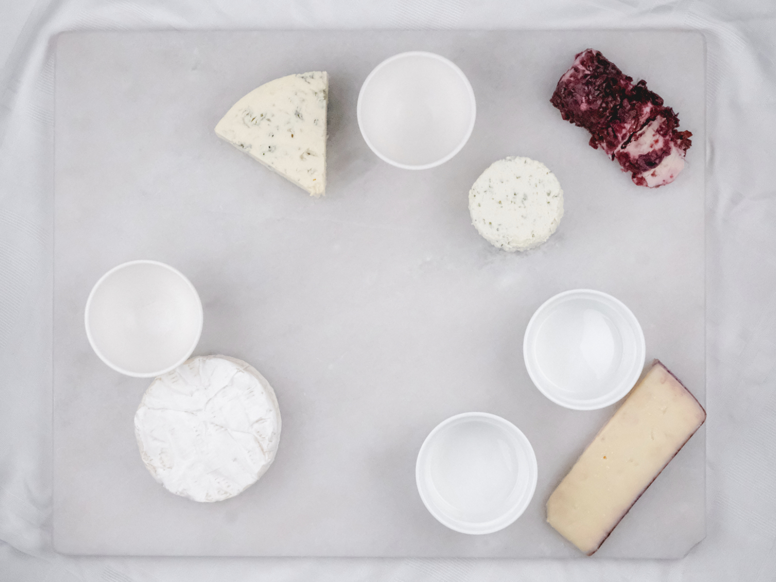 setting cheese and bowls for a grazing board