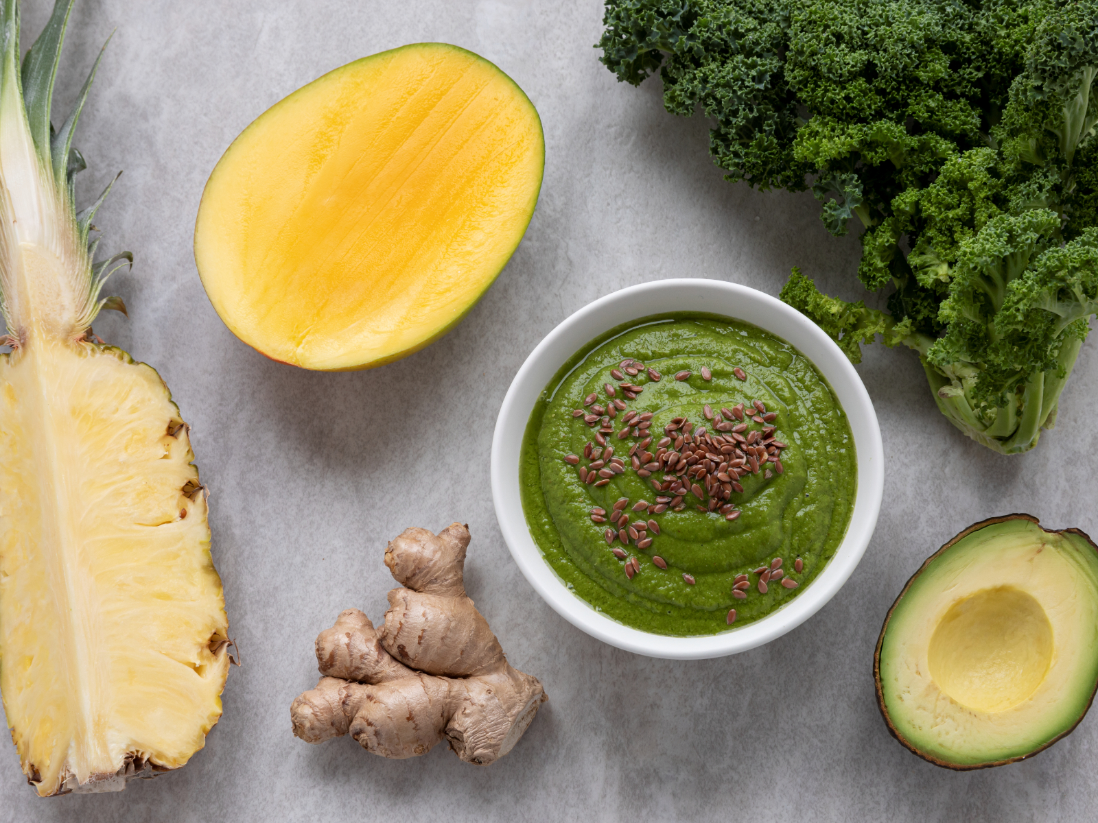 Smoothie bowl with kale, pineapple, and ginger and avocado