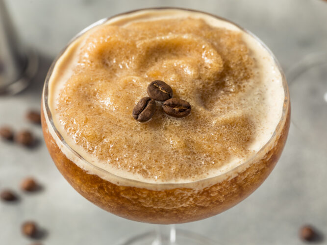 healthy frozen espresso martini in a glass with espresso beans