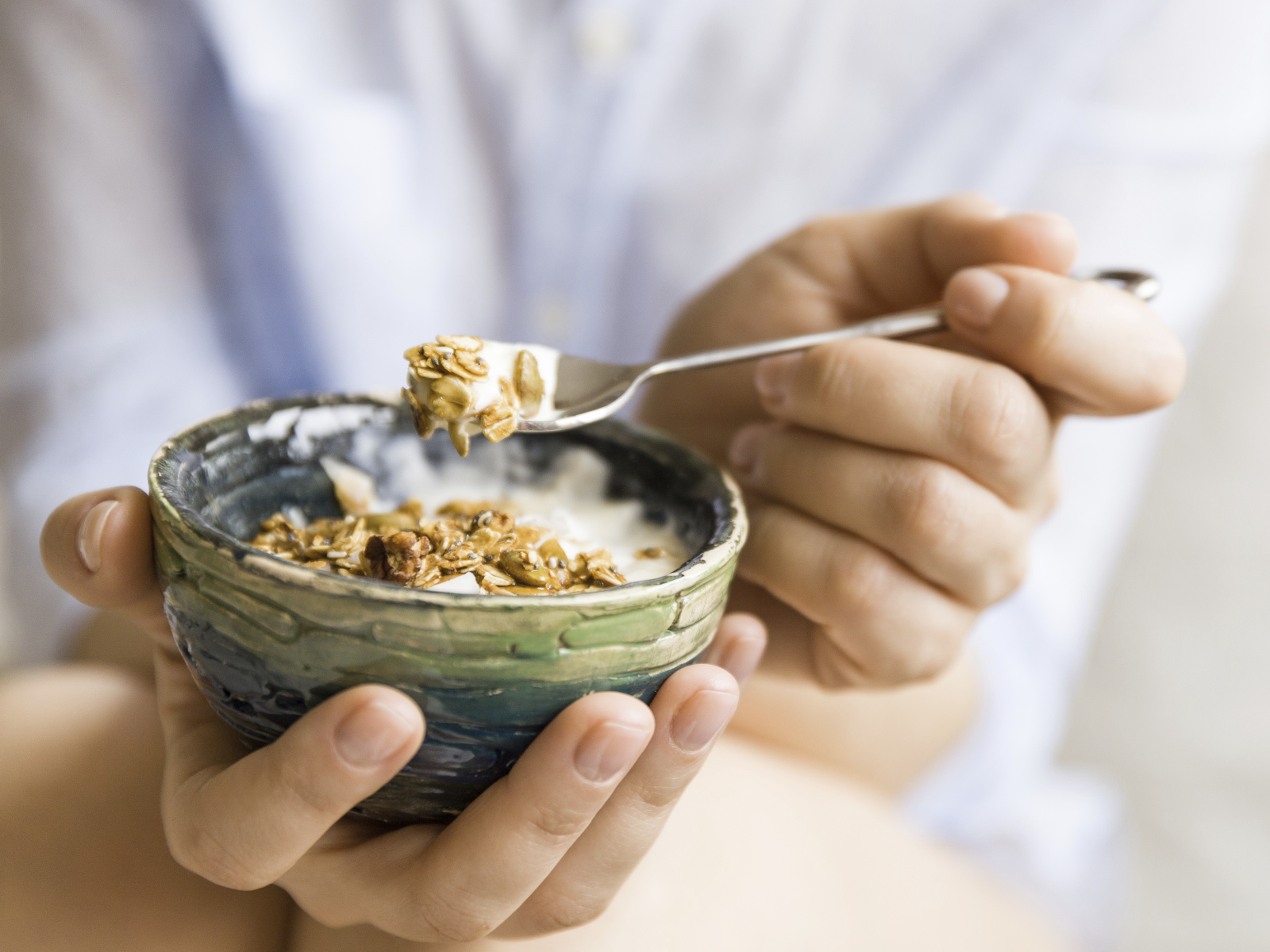 spoonful of yogurt with granola