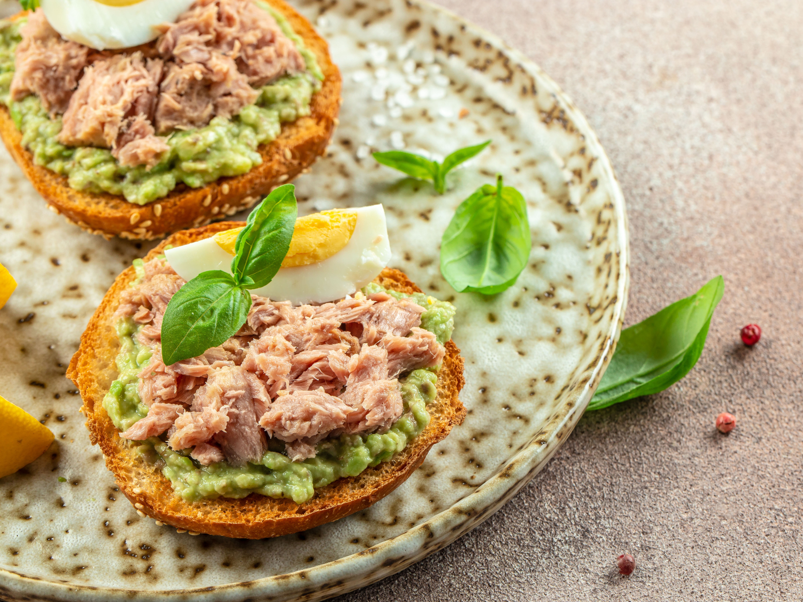tuna salad on bread with avocado and egg