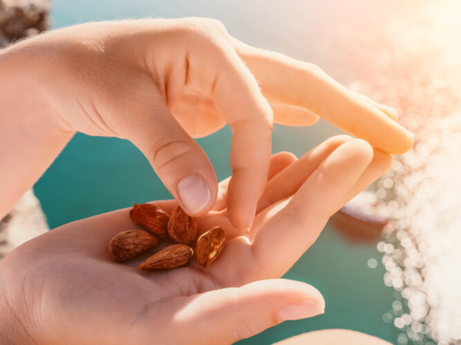 almond snack in a woman's hands