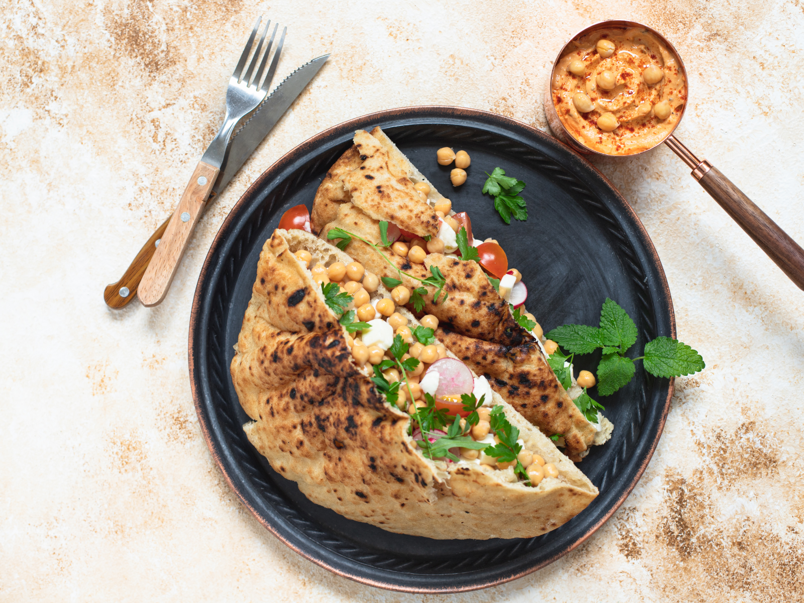 whole grain pita with chickpea and veggies and tahini