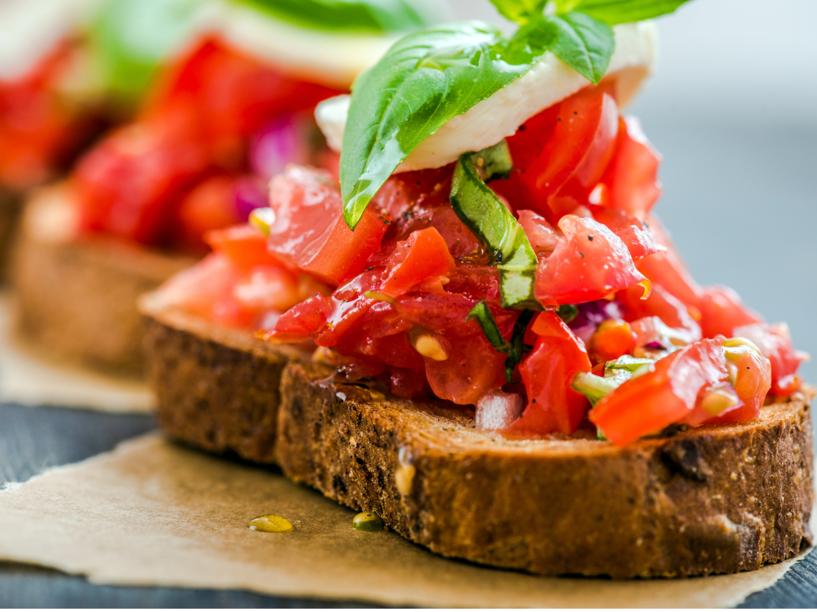 bruschetta slice with tomatoes and basil