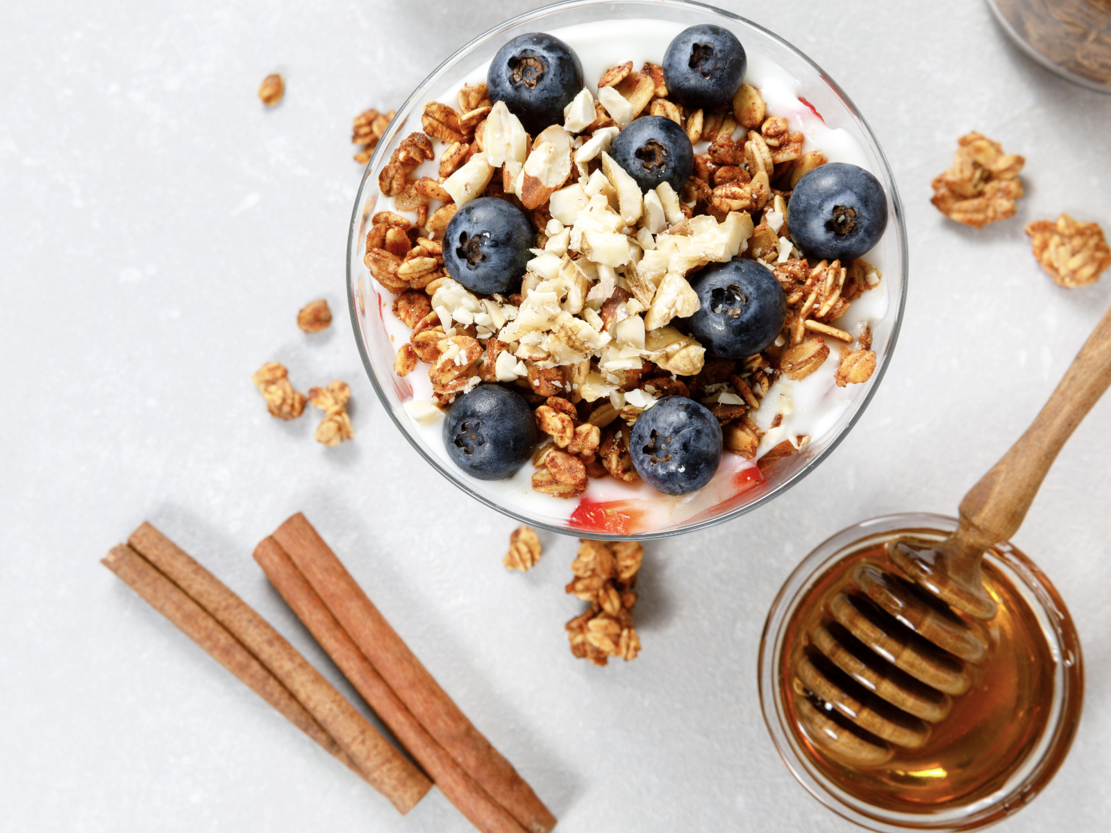 parfait with nuts blueberries granola and honey