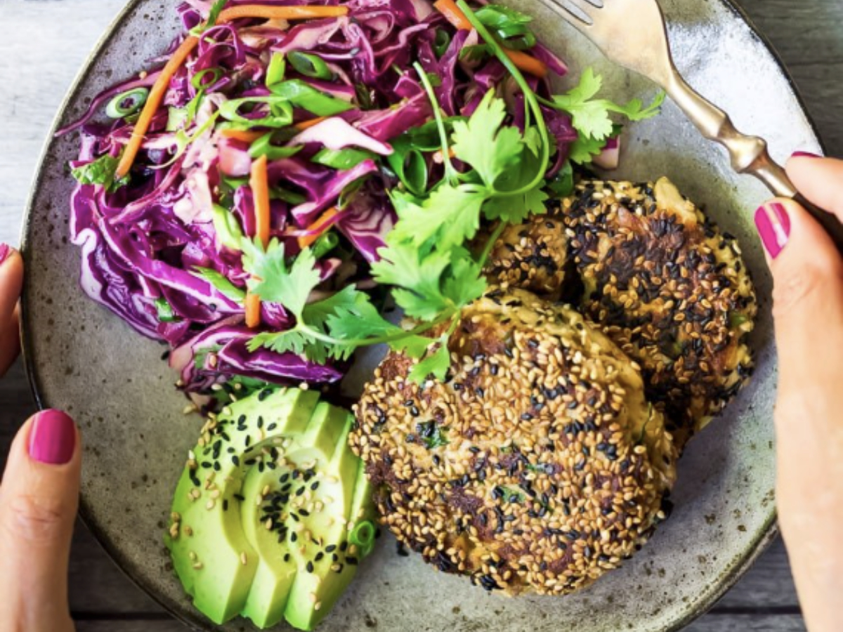 simple salmon cakes with side salad and avocado