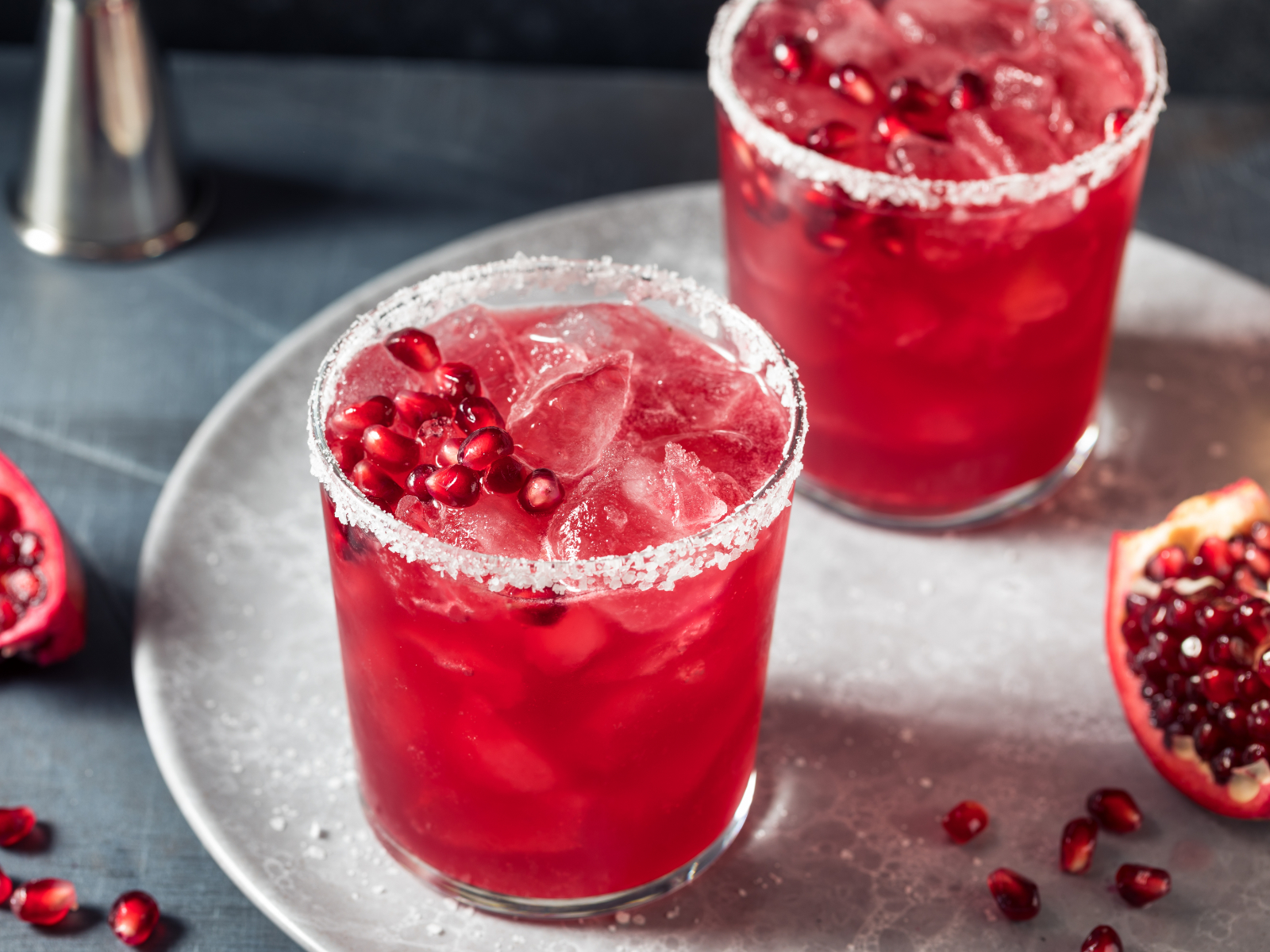 two pomegranate margaritas on a table