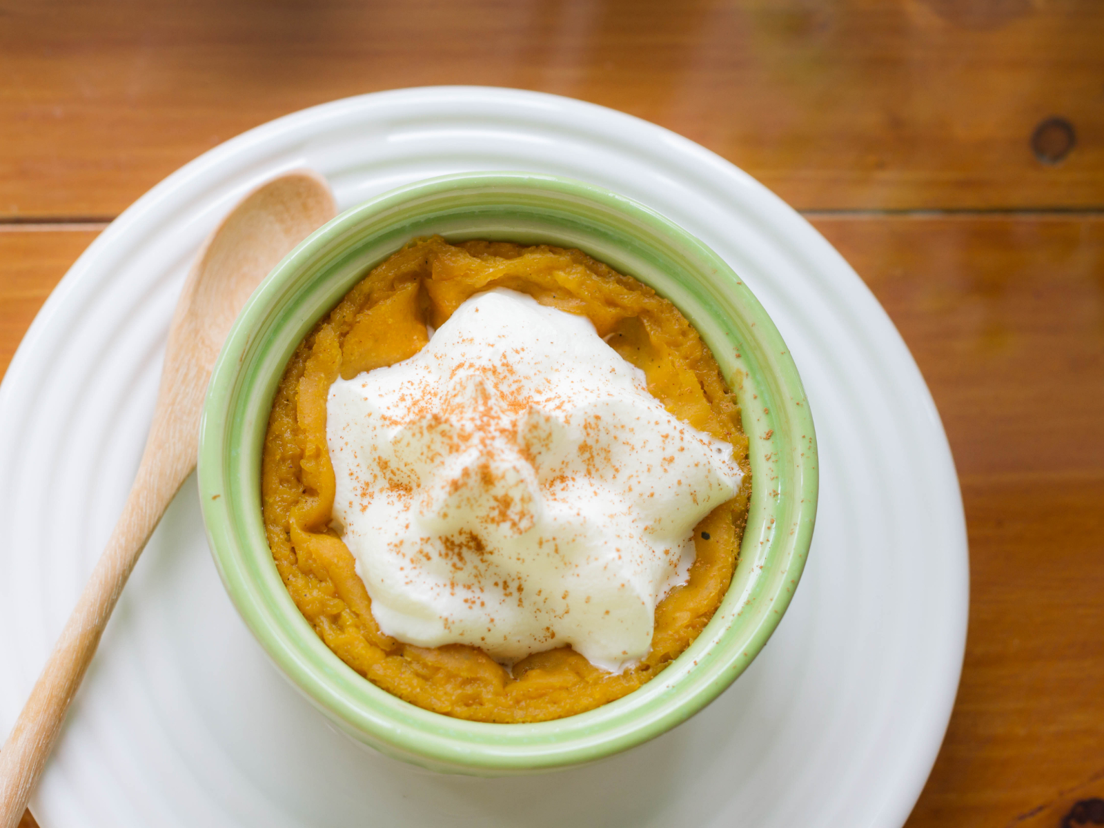 pumpkin pudding with whipped cream and cinnamon