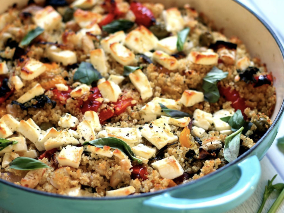 roasted vegetables with feta and quinoa in a dutch oven