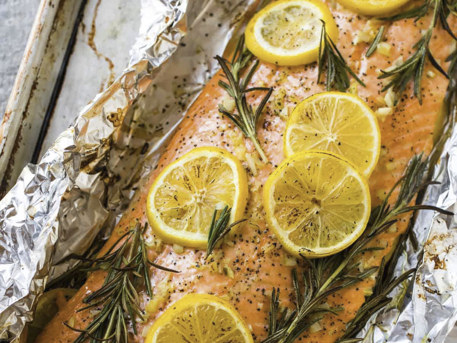 Baked Salmon with lemon slices and rosemary