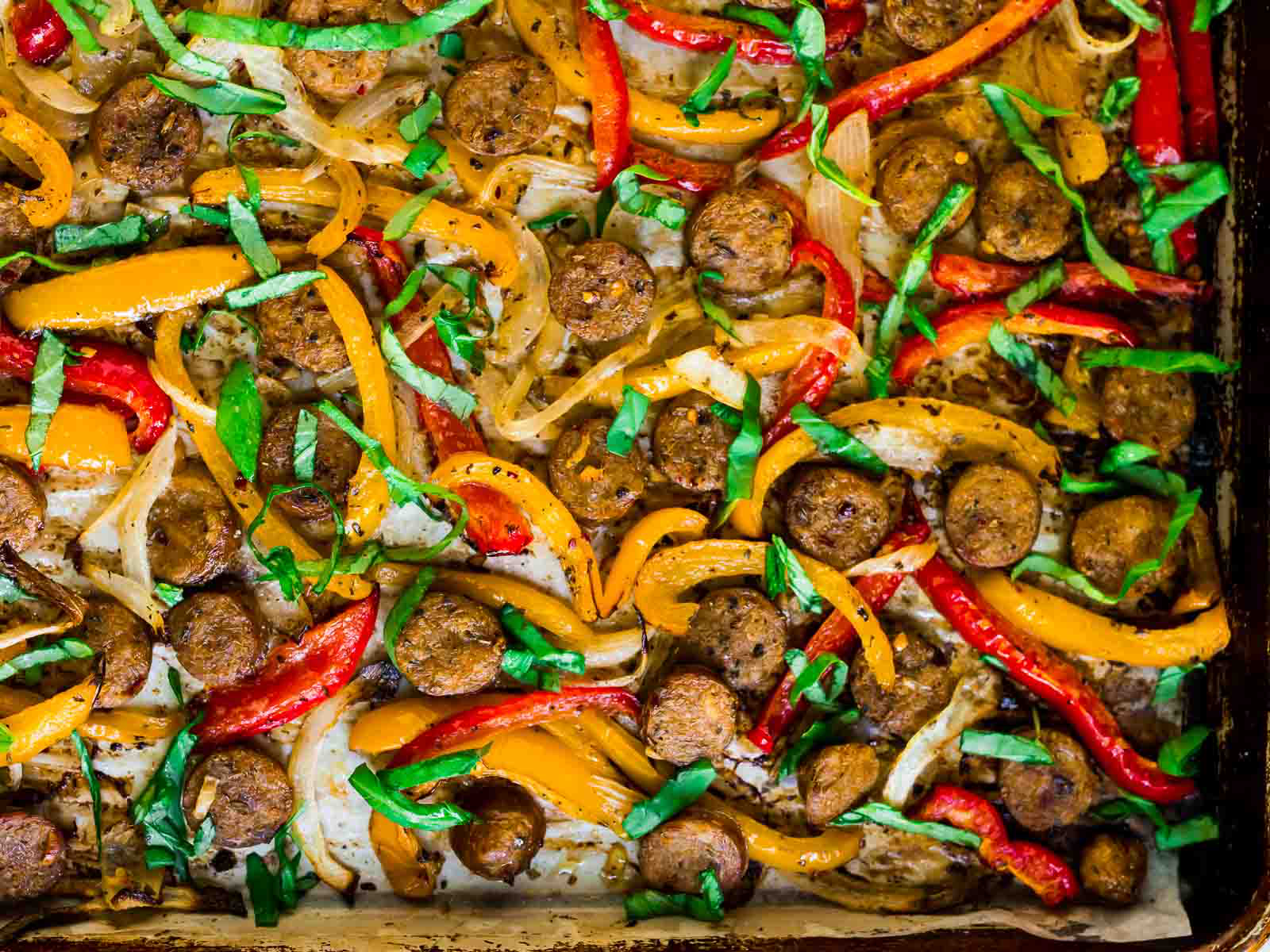 sausage and peppers on a sheet pan