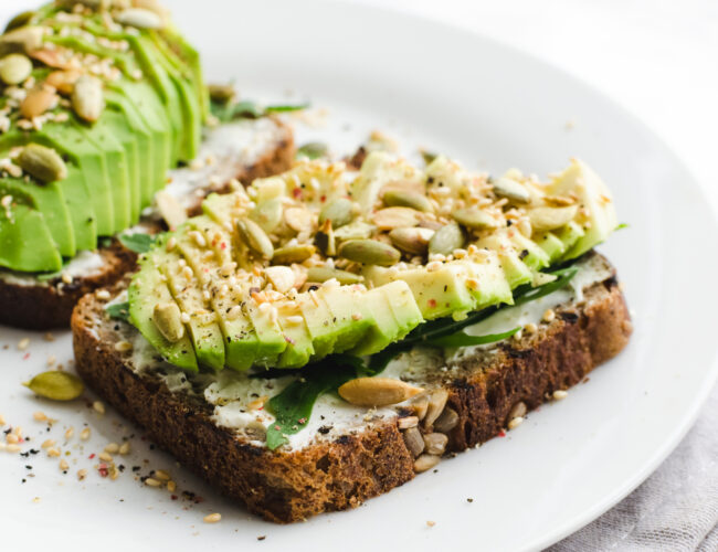 avocado toast topped with pumpkin seeds