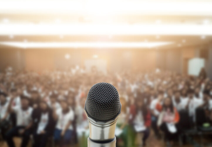 A microphone set up before a public speaking event
