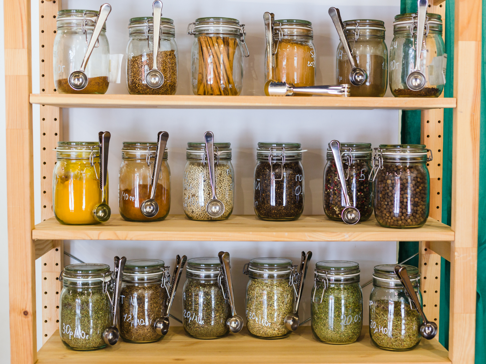 cabinet of spices in mason jars