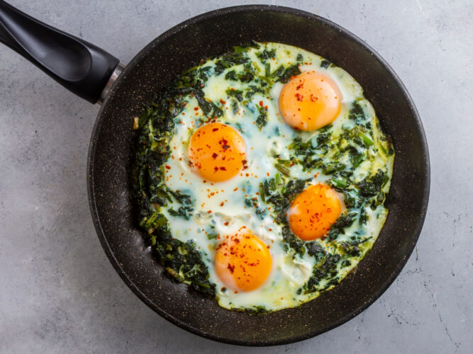 spinach and eggs in a skillet
