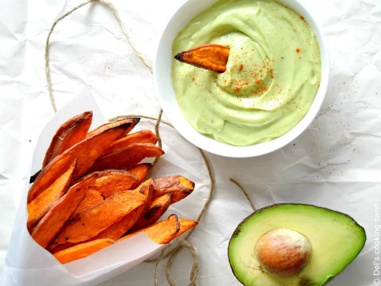 sweet potato fries with avocado dip on a table