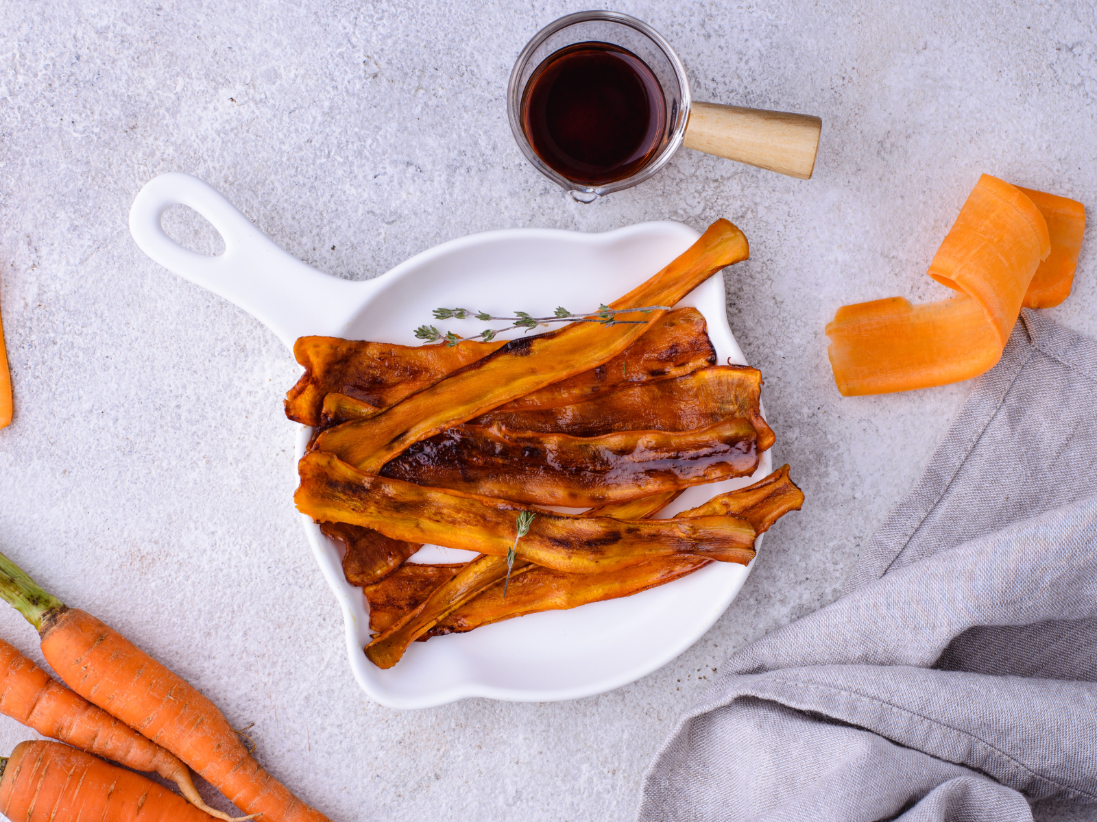 finished carrot bacon on a skillet