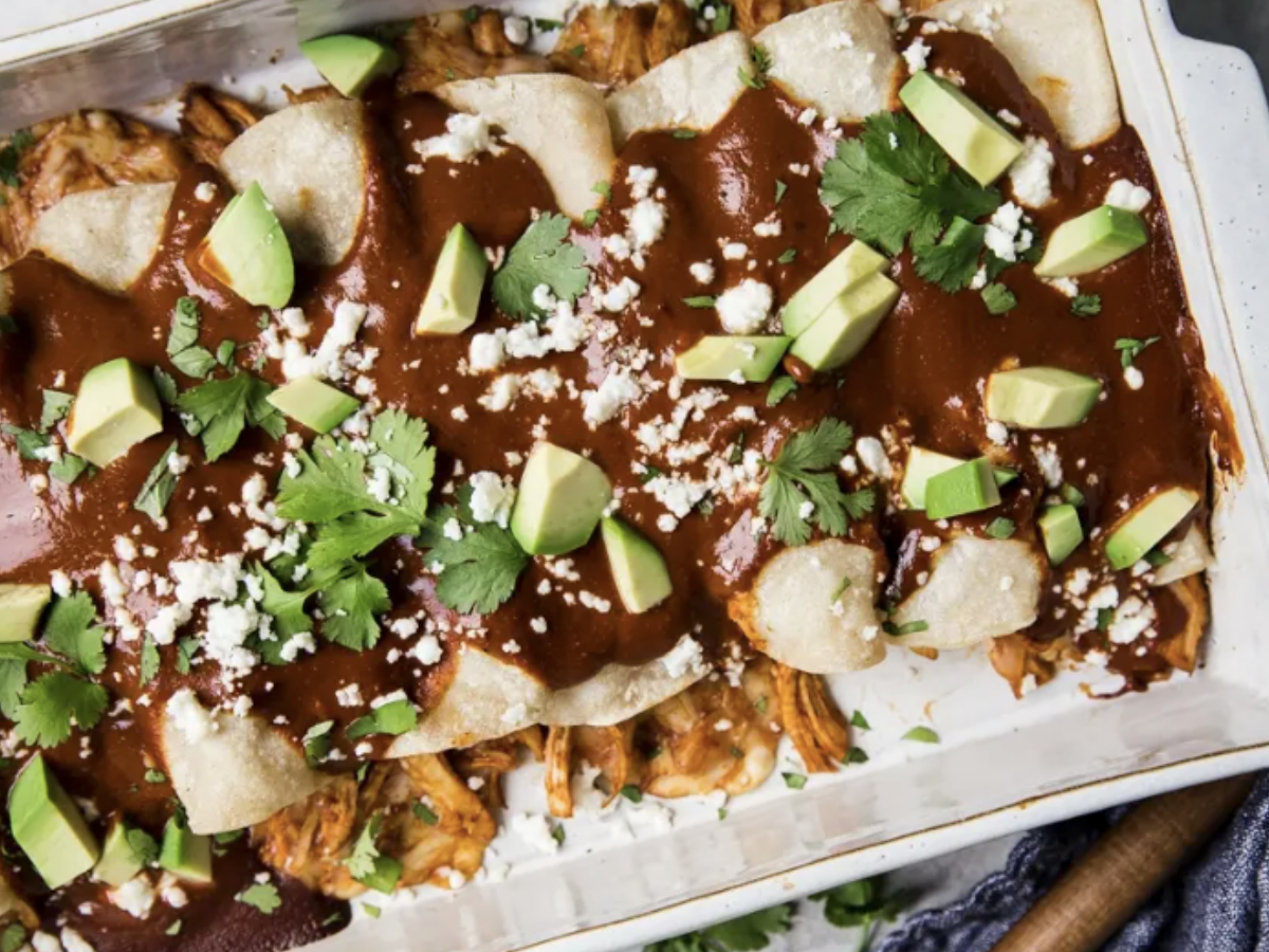 weeknight chicken mole enchiladas in a casserole dish