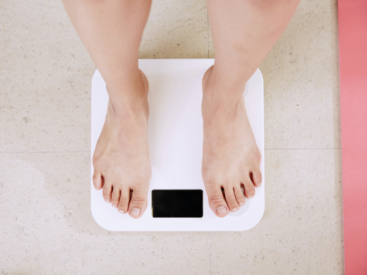 person standing on weight scale
