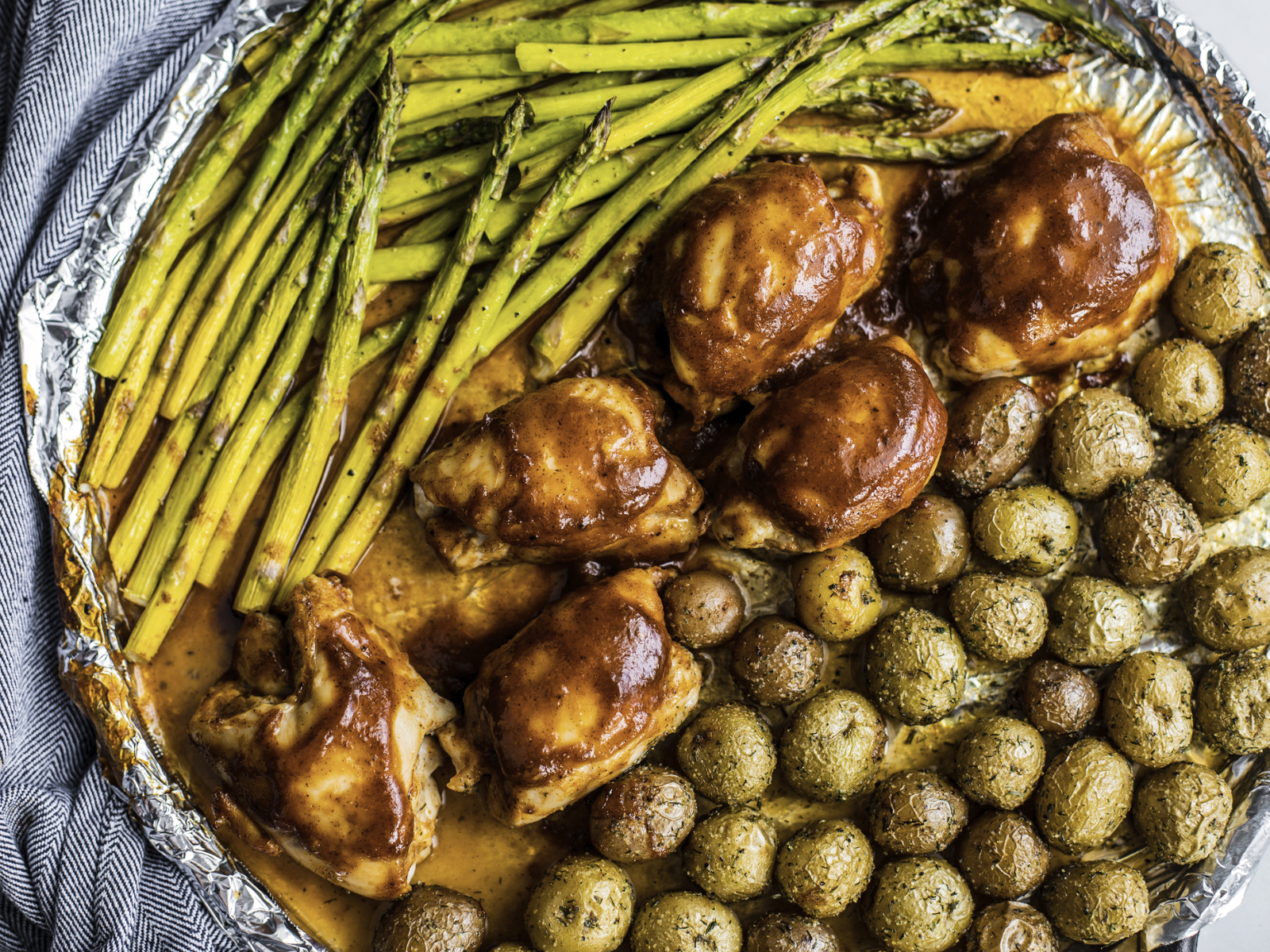 BBQ chicken with roasted asparagus and potatoes