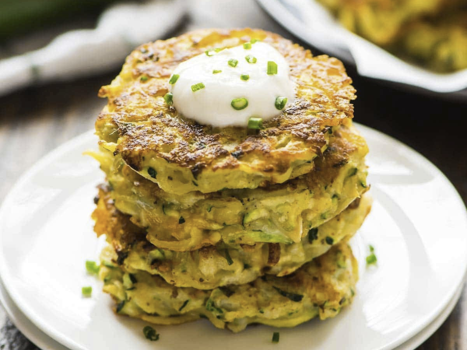 zucchini potato fritters with sour cream topping